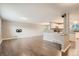 Open living room with hardwood floors and kitchen access at 9014 W Harvard Dr, Lakewood, CO 80227