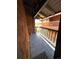 Balcony has charcoal grey wood-look tiles and a wood and iron safety rail at 1273 S Crystal Way, Aurora, CO 80012
