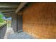 Covered front porch with wood plank tiles and wood paneled exterior provides curb appeal at 1273 S Crystal Way, Aurora, CO 80012
