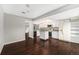 Well-lit kitchen featuring white cabinets, a movable island, and modern appliances, creating an open, inviting space at 1273 S Crystal Way, Aurora, CO 80012