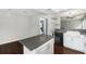 Well-equipped kitchen with a movable island, updated appliances, and an open design, perfect for cooking and entertaining at 1273 S Crystal Way, Aurora, CO 80012