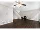 Cozy living room with dark wood floors, a decorative fireplace and staircase, ideal for a relaxing evening at home at 1273 S Crystal Way, Aurora, CO 80012