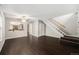Inviting living room featuring wood floors, a ceiling fan, and staircase access to upper level, perfect for entertaining at 1273 S Crystal Way, Aurora, CO 80012