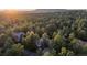 Stunning aerial view of a home nestled in a dense forest with scenic mountain views at 474 Silbrico Way, Castle Rock, CO 80108
