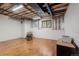 Spacious unfinished basement with wood floors, ready to be personalized into a playroom or home theater at 474 Silbrico Way, Castle Rock, CO 80108
