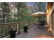 Outdoor deck with patio furniture and views of the surrounding greenery at 474 Silbrico Way, Castle Rock, CO 80108