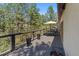 Inviting wooden deck with an outdoor dining table and views of the backyard, perfect for entertaining at 474 Silbrico Way, Castle Rock, CO 80108