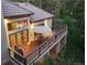 Aerial view of the home's deck, complete with outdoor dining set and grill for enjoyable outdoor living and entertaining at 474 Silbrico Way, Castle Rock, CO 80108