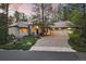 Stunning exterior elevation features lush landscaping, stone driveway, and attached three-car garage at 474 Silbrico Way, Castle Rock, CO 80108