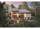 Rear exterior elevation of the home highlighting the deck and beautifully wooded surroundings at 474 Silbrico Way, Castle Rock, CO 80108
