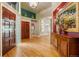 Inviting foyer features hardwood floors, an elegant chandelier, and views of the dining area and sitting room at 474 Silbrico Way, Castle Rock, CO 80108