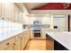 Kitchen showcasing updated appliances, tile backsplash, and abundant cabinet space at 474 Silbrico Way, Castle Rock, CO 80108