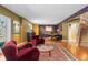 Inviting living room features hardwood floors, vibrant accent walls, and cozy seating for relaxation or entertaining at 474 Silbrico Way, Castle Rock, CO 80108