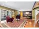 Inviting living room features hardwood floors, vibrant accent walls, and cozy seating with patio access at 474 Silbrico Way, Castle Rock, CO 80108