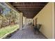 Covered patio with a stone floor and view of the surrounding nature at 474 Silbrico Way, Castle Rock, CO 80108