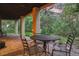 Outdoor patio area features a round table with seating and scenic views of the surrounding landscape at 474 Silbrico Way, Castle Rock, CO 80108