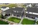 Aerial view of homes with well-manicured lawns and putting greens, showcasing the neighborhood's appeal at 2637 Gray Wolf Pl, Castle Rock, CO 80104