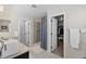 Bright bathroom featuring a shower, closet, and sink for convenience at 2637 Gray Wolf Pl, Castle Rock, CO 80104