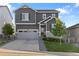 Charming two-story home featuring stone accents, a well-kept lawn, and a spacious two car garage at 2637 Gray Wolf Pl, Castle Rock, CO 80104