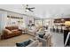 Spacious living room with neutral tones, open to the dining area and kitchen, perfect for entertaining at 2637 Gray Wolf Pl, Castle Rock, CO 80104