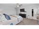 Spacious main bedroom featuring a plush bed, soft lighting, and a bright window; offering rest and relaxation at 2637 Gray Wolf Pl, Castle Rock, CO 80104