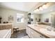 Bright bathroom with double sinks, a soaking tub, and ample storage, providing a functional and stylish space at 8300 Fairmount Dr # Qq102, Denver, CO 80247