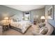 Tranquil bedroom with a comfortable bed, soft lighting, and a cozy sitting area for relaxation at 8300 Fairmount Dr # Qq102, Denver, CO 80247