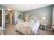 Comfortable bedroom with neutral colored walls, carpet, furniture and a connecting bathroom and closet at 8300 Fairmount Dr # Qq102, Denver, CO 80247