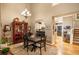 Elegant dining area with hardwood floors, chandelier lighting, and open access to the adjacent kitchen at 8300 Fairmount Dr # Qq102, Denver, CO 80247