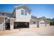Exterior image of a home with open garage providing parking and storage at 8300 Fairmount Dr # Qq102, Denver, CO 80247