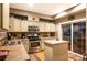Well-equipped kitchen with stainless steel appliances, ample cabinetry, and a convenient center island at 8300 Fairmount Dr # Qq102, Denver, CO 80247