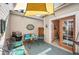 Cozy outdoor patio, perfect for relaxing or entertaining, with comfortable seating and a shade covering at 8300 Fairmount Dr # Qq102, Denver, CO 80247