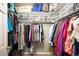 Organized walk-in closet with ample shelving and hanging space, providing a practical storage solution at 8300 Fairmount Dr # Qq102, Denver, CO 80247