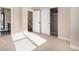 Sunlit bedroom with a double closet and ensuite bathroom access, designed for seamless living at 888 S Valentia St # 103, Denver, CO 80247