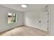 A bright, light-filled, bedroom features a large window with an exterior view at 3736 S Hibiscus Way, Denver, CO 80237