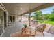 Inviting covered patio featuring stylish seating, perfect for outdoor relaxation and entertaining at 3736 S Hibiscus Way, Denver, CO 80237