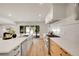 Bright, modern kitchen with stainless steel appliances, stylish cabinetry, and an inviting island with plenty of counter space at 3736 S Hibiscus Way, Denver, CO 80237