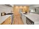 Sleek modern kitchen featuring a large island, stainless steel appliances, and ample cabinet space for storage at 3736 S Hibiscus Way, Denver, CO 80237