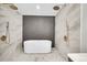 Elegant main bathroom featuring a soaking tub with dual shower heads and contemporary tile work at 3736 S Hibiscus Way, Denver, CO 80237