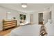 Serene main bedroom with sliding glass doors to the backyard and a view of the patio at 3736 S Hibiscus Way, Denver, CO 80237
