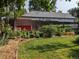 Landscaped backyard featuring a lush garden and shed; perfect for outdoor relaxation at 4416 Brentwood St, Wheat Ridge, CO 80033