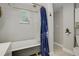 Charming bathroom features a classic clawfoot tub, shower, and decorative accents at 4416 Brentwood St, Wheat Ridge, CO 80033