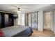 Comfortable bedroom with a full size bed, ceiling fan, and ensuite bathroom at 4416 Brentwood St, Wheat Ridge, CO 80033