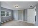 Comfortable bedroom features a window, neutral carpet, baseboard heating, and a lighted ceiling fan at 4416 Brentwood St, Wheat Ridge, CO 80033