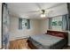 Comfortable bedroom with a full size bed, ceiling fan and dual windows to let in the sun at 4416 Brentwood St, Wheat Ridge, CO 80033