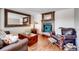 Cozy living room featuring a fireplace, hardwood floors, and comfortable seating at 4416 Brentwood St, Wheat Ridge, CO 80033