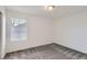 A bright bedroom with carpet and a window lets in ample natural light at 645 Flintwood Pl, Lafayette, CO 80026