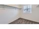 A walk-in closet with rod, shelf, and window offers practical storage space at 645 Flintwood Pl, Lafayette, CO 80026