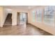 Bright living room featuring modern flooring, large windows, and a sliding door leading to a deck at 645 Flintwood Pl, Lafayette, CO 80026