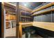 Basement storage featuring shelving, countertop with sink, and tile flooring at 5285 E Iliff Ave, Denver, CO 80222